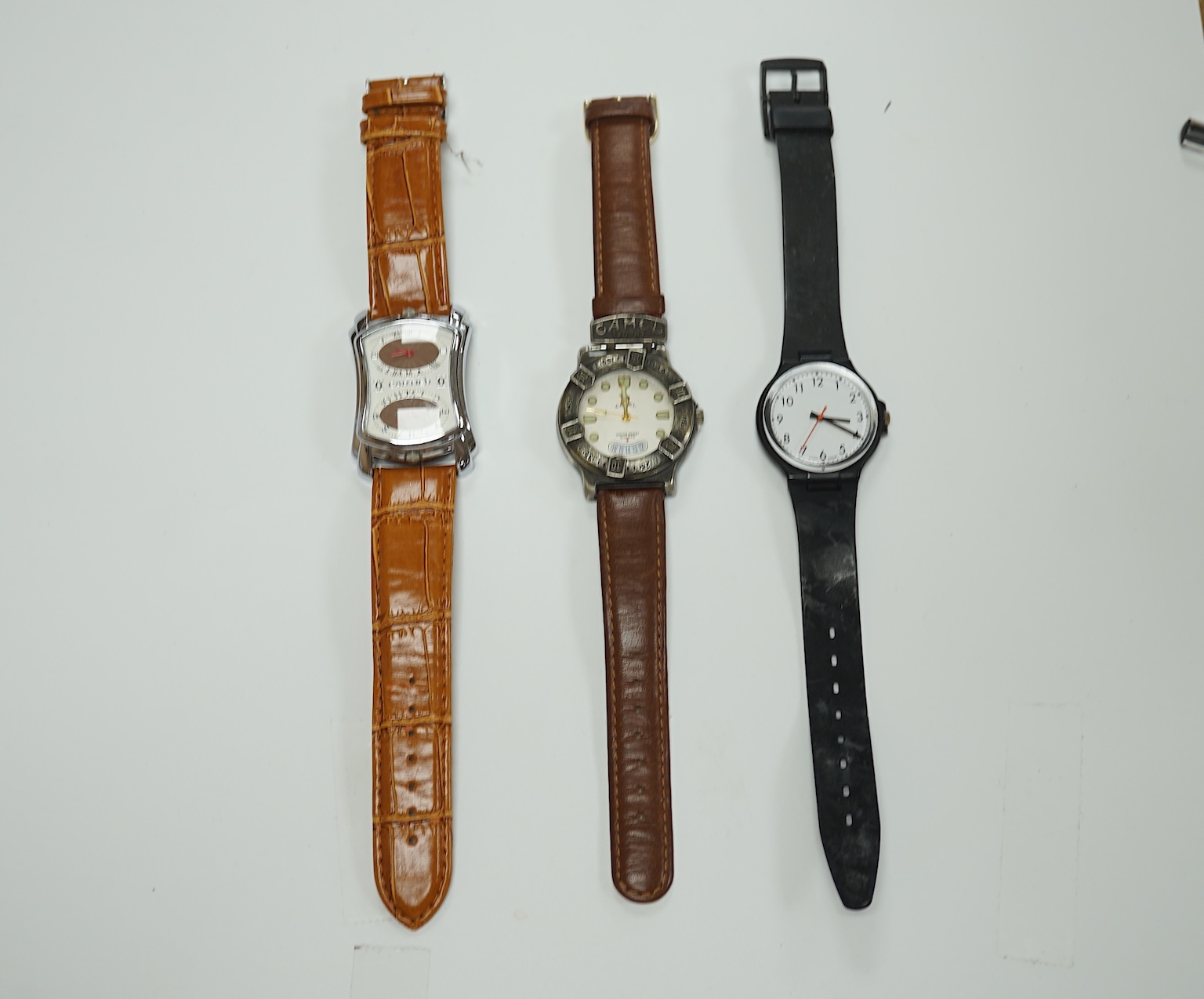 A group of assorted modern wrist watches including Sekonda, Camel and Timex Snoopy, together with two alarm clocks including Mickey Mouse. Condition - poor to fair